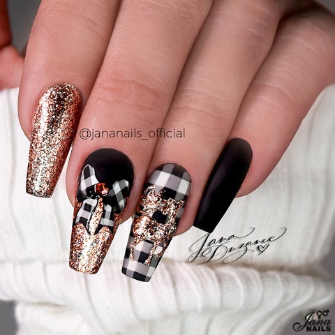 designer nails black and gold bow